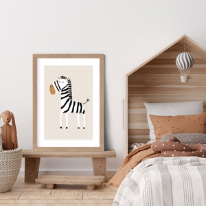 May include: A framed print of a black and white zebra with a brown nose and hooves. The zebra is standing on a beige background. The frame is made of light wood.