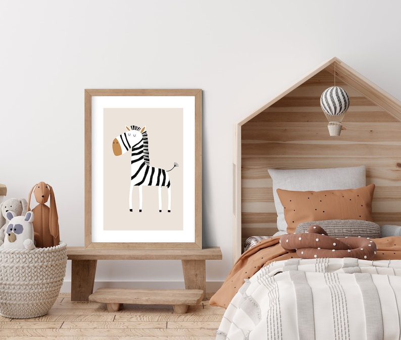 May include: A framed print of a black and white zebra with a brown nose and hooves. The zebra is standing on a beige background. The frame is made of light wood.