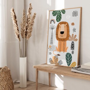 May include: A colorful illustration of a lion with a whimsical jungle scene. The lion is orange with a brown mane and a friendly expression. The background features green leaves, a rainbow, and abstract shapes in black, white, and orange.