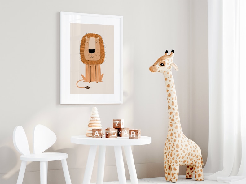 May include: A white framed print of a cartoon lion with a brown mane and a light brown body. The print is hanging on a white wall. There is a white table with a wooden stacking toy and wooden alphabet blocks on it. A white chair with bunny ears is next to the table. A large stuffed giraffe with brown spots is standing on the floor.