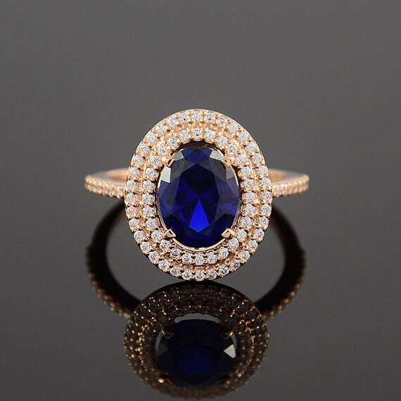 rose gold ring with blue stone