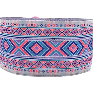 May include: A roll of light blue elastic trim with a pink, blue, and purple geometric pattern.
