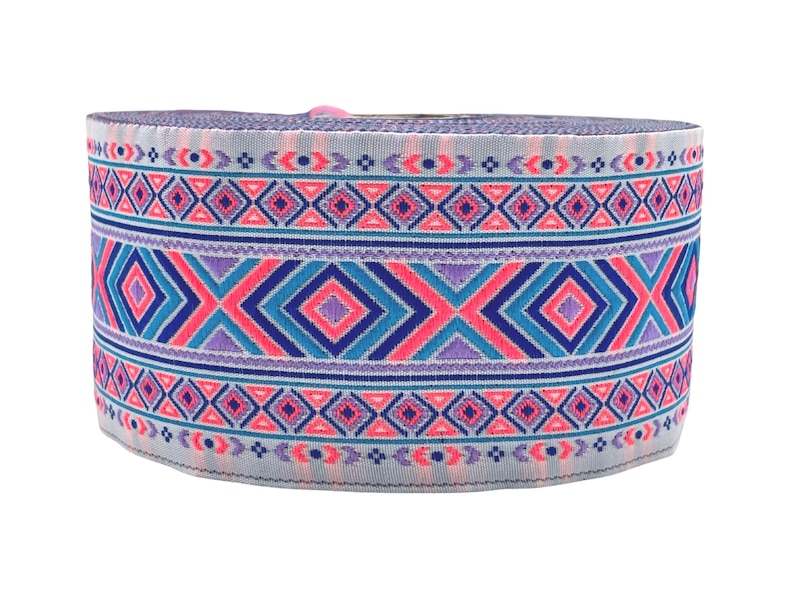May include: A roll of light blue elastic trim with a pink, blue, and purple geometric pattern.