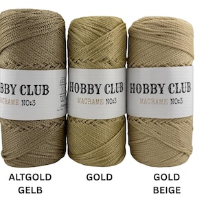 Drei hochwertige Makramee-Garne von Hobby Club Macrame No.3 in den Farben Altgoldgelb, Gold und Goldbeige, ideal für edle Makramee- und Dekorationsprojekte, auf weißem Hintergrund dargestellt.