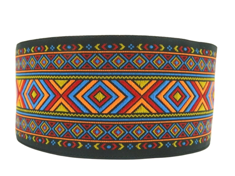 May include: Black fabric trim with a colorful geometric pattern featuring red, orange, blue, and yellow diamonds. The pattern is repeated along the length of the trim.