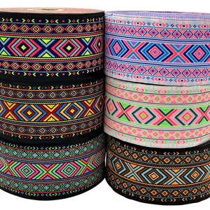 May include: Six rolls of black and white patterned trim with geometric designs. The trim is in various colors including pink, blue, green, orange, and yellow. The trim is labeled V1, V2, V3, V4, V5, and V6.