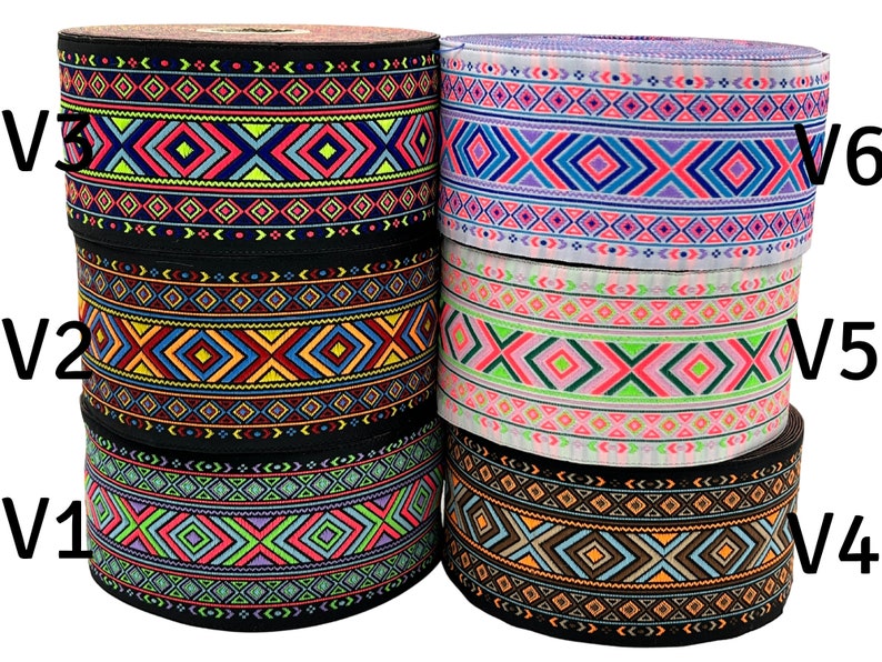 May include: Six rolls of black and white patterned trim with geometric designs. The trim is in various colors including pink, blue, green, orange, and yellow. The trim is labeled V1, V2, V3, V4, V5, and V6.