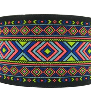 May include: Black fabric trim with a colorful geometric pattern in shades of blue, green, pink, and yellow. The pattern features repeating diamond shapes and zigzags.