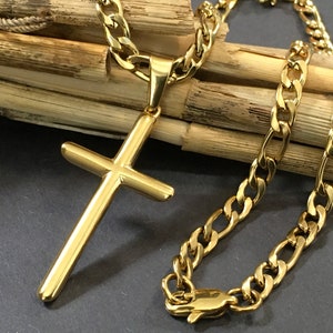 May include: A gold chain necklace with a gold cross pendant. The chain is a curb style and the cross is simple and flat.