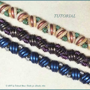 May include: Three beaded bracelets in different colors and patterns. The top bracelet is white, copper, and green. The middle bracelet is purple and silver. The bottom bracelet is blue and silver. The bracelets are on a white background. TUTORIAL.