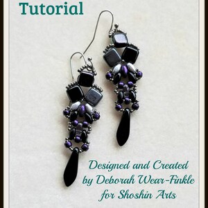May include: A pair of black and silver beaded earrings with a teardrop shape. The earrings are designed and created by Deborah Wear-Finkle for Shoshin Arts.