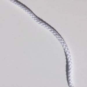 May include: A close-up shot of a white, braided rope against a white background. The rope is thick and appears to be made of a soft, woven material. The texture of the rope is clearly visible, with each strand tightly woven together.
