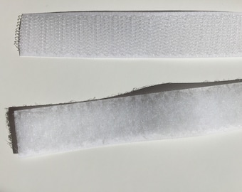 May include: Two strips of white hook and loop fastener tape. The top strip is the hook side and the bottom strip is the loop side.