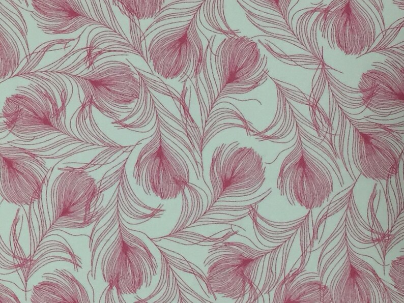 May include: A seamless pattern of pink feathers on a light blue background. The feathers are drawn in a detailed, intricate style.