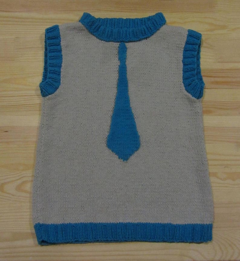 Knitted vest with a tie for a boy.