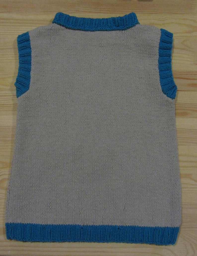 Knitted vest with a tie for a boy.