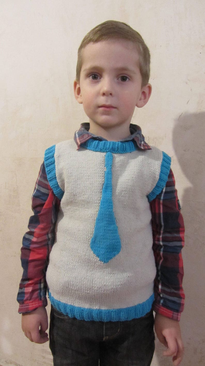 Knitted vest with a tie for a boy.