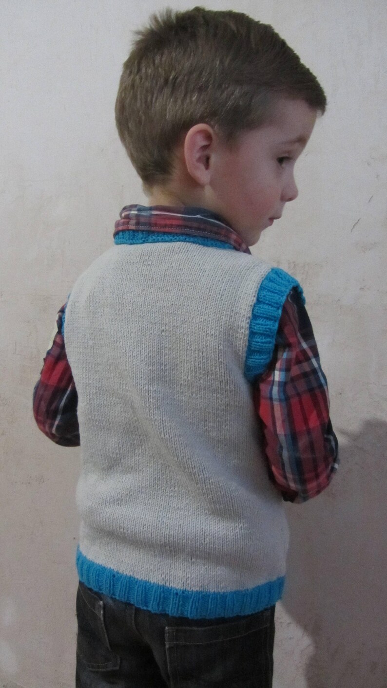 Knitted vest with a tie for a boy.