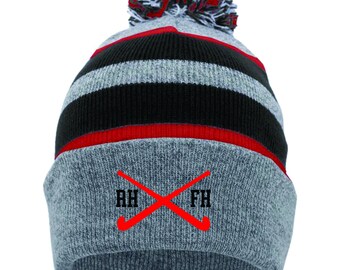 Cappello invernale con pompon da hockey su prato