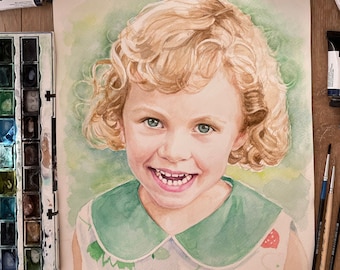May include: Watercolor painting of a young girl with blonde curly hair wearing a green collared dress with a floral pattern. The girl is smiling and looking at the viewer.