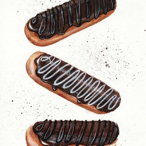 May include: Three eclairs with chocolate and white icing on a white background.