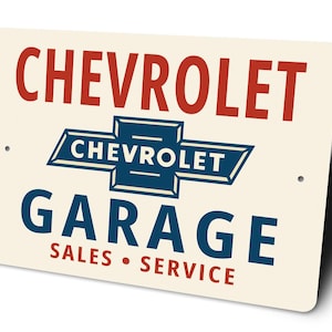 a sign for a Chevrolet garage that includes the Chevrolet logo and text indicating it is a sales and service center.