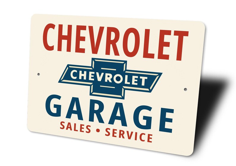 a sign for a Chevrolet garage that includes the Chevrolet logo and text indicating it is a sales and service center.