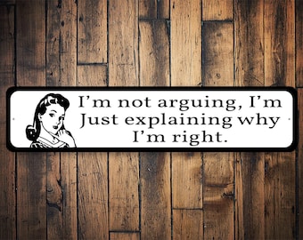 May include: Black and white sign with a woman's illustration and the text "I'm not arguing, I'm just explaining why I'm right."