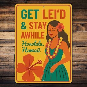 May include: Rectangular yellow metal sign with a retro illustration of a woman wearing a lei and a flower in her hair. The sign reads "GET LEI'D & STAY AWHILE Honolulu, Hawaii" in teal and orange lettering. A large orange hibiscus flower is in the lower left.