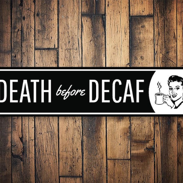 May include: Black and white sign with the text "DEATH before DECAF" and a cartoon image of a woman drinking coffee. 