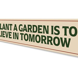 a sign that says to plant a garden is to believe in tomorrow