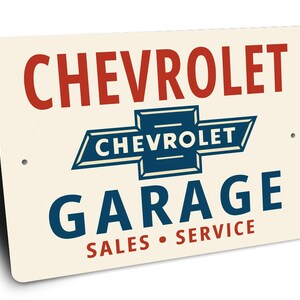 a sign for a Chevrolet garage, with the Chevrolet logo prominently displayed.