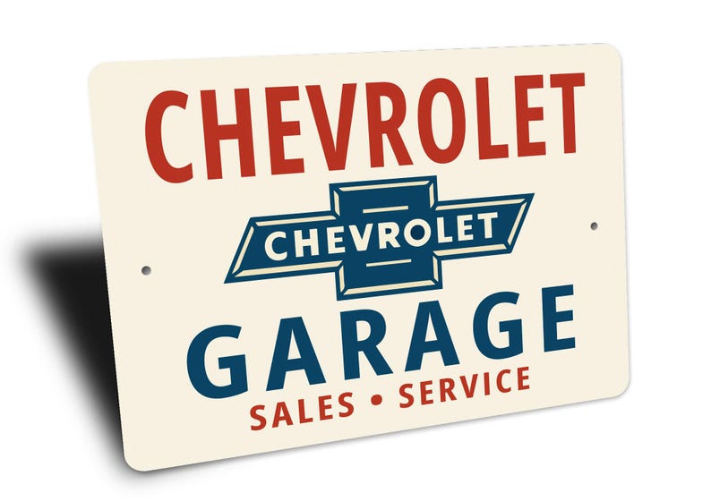 a sign for a Chevrolet garage, with the Chevrolet logo prominently displayed.