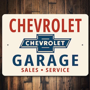 a sign for a Chevrolet garage that is for sale or service.