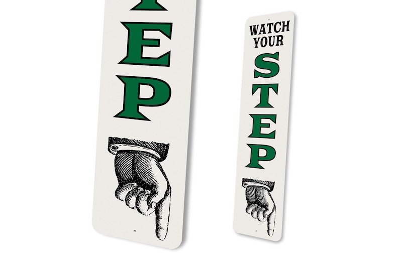two signs with the same text and a hand pointing to the right.