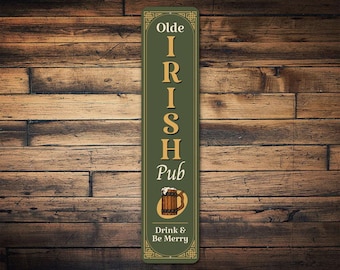 May include: A green and gold sign with the text "Olde Irish Pub" and a graphic of a beer stein. The sign also says "Drink & Be Merry".