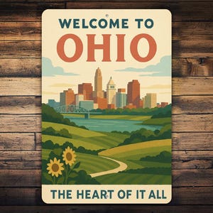 May include: A rectangular sign with the words "WELCOME TO OHIO" in teal and orange. The sign features a cityscape, a river, rolling green hills, and sunflowers. The text "THE HEART OF IT ALL" is at the bottom.