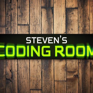 May include: A rectangular sign with the text "STEVEN'S CODING ROOM" in white and neon green against a black background. The sign is mounted on a wooden plank wall.