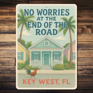 May include: A vintage-style metal sign featuring a tropical scene with the text "NO WORRIES AT THE END OF THE ROAD" above a teal house and palm trees. The sign also says "KEY WEST, FL" and has a rooster.