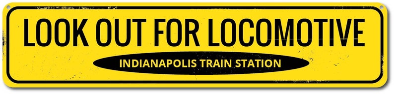 May include: Yellow warning sign with black text that reads "LOOK OUT FOR LOCOMOTIVE" and "INDIANAPOLIS TRAIN STATION".