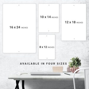 a white table with a white chair next to it