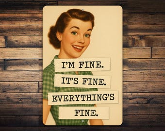 May include: A vintage-style sign featuring a smiling woman in a green plaid shirt. The sign has the phrases "I'M FINE. IT'S FINE. EVERYTHING'S FINE." printed on it. The background is a wooden plank design.