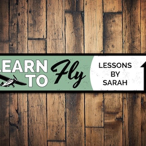 Learn To Fly Here Sign At Airport Stock Photo - Download Image Now