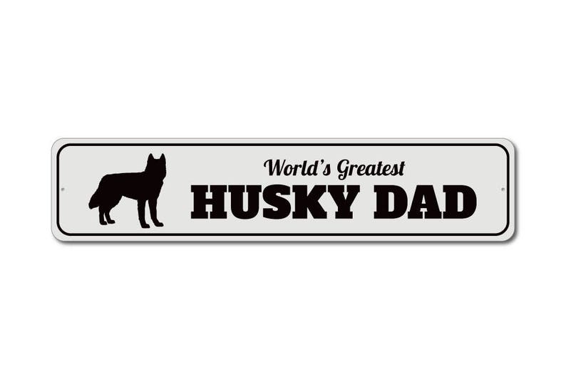May include: A white metal sign with a black silhouette of a husky dog and the text "World's Greatest Husky Dad".