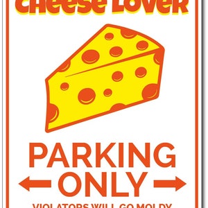 May include: A white metal sign with orange text and a cartoon image of a yellow wedge of cheese with orange holes. The sign reads "Cheese Lover Parking Only" and "Violators Will Go Moldy".
