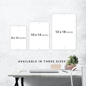 a white table with a white chair next to it