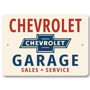 a sign for a Chevrolet garage that includes the Chevrolet logo and text indicating that it is a sales and service center.