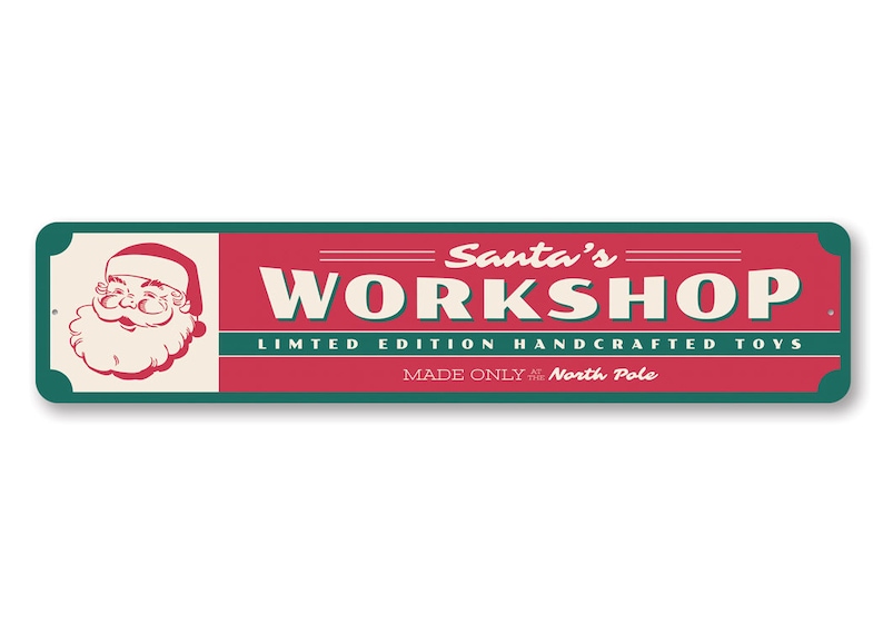 May include: A red and green sign with the text "Santa's Workshop" in white. The sign also says "Limited Edition Handcrafted Toys" and "Made Only at the North Pole". A cartoon image of Santa Claus is in the upper left corner of the sign.
