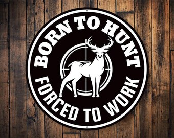May include: Black and white metal sign with the text "Born to Hunt Forced to Work" and a silhouette of a deer in a crosshair target.