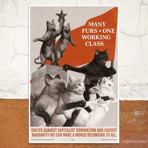 May include: A propaganda poster featuring a group of cats with a red flag that reads "MANY FURS * ONE WORKING CLASS". The poster is set against a white brick wall. The cats are depicted in a socialist style, with the black cat holding the flag and the other cats standing on a platform.